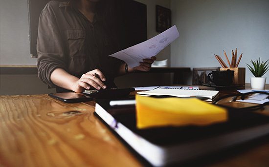 Executor reviewing estate accounting records and financial documents
